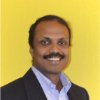 Eby Ramakrishnan in a close-cropped head-and-shoulders portrait.